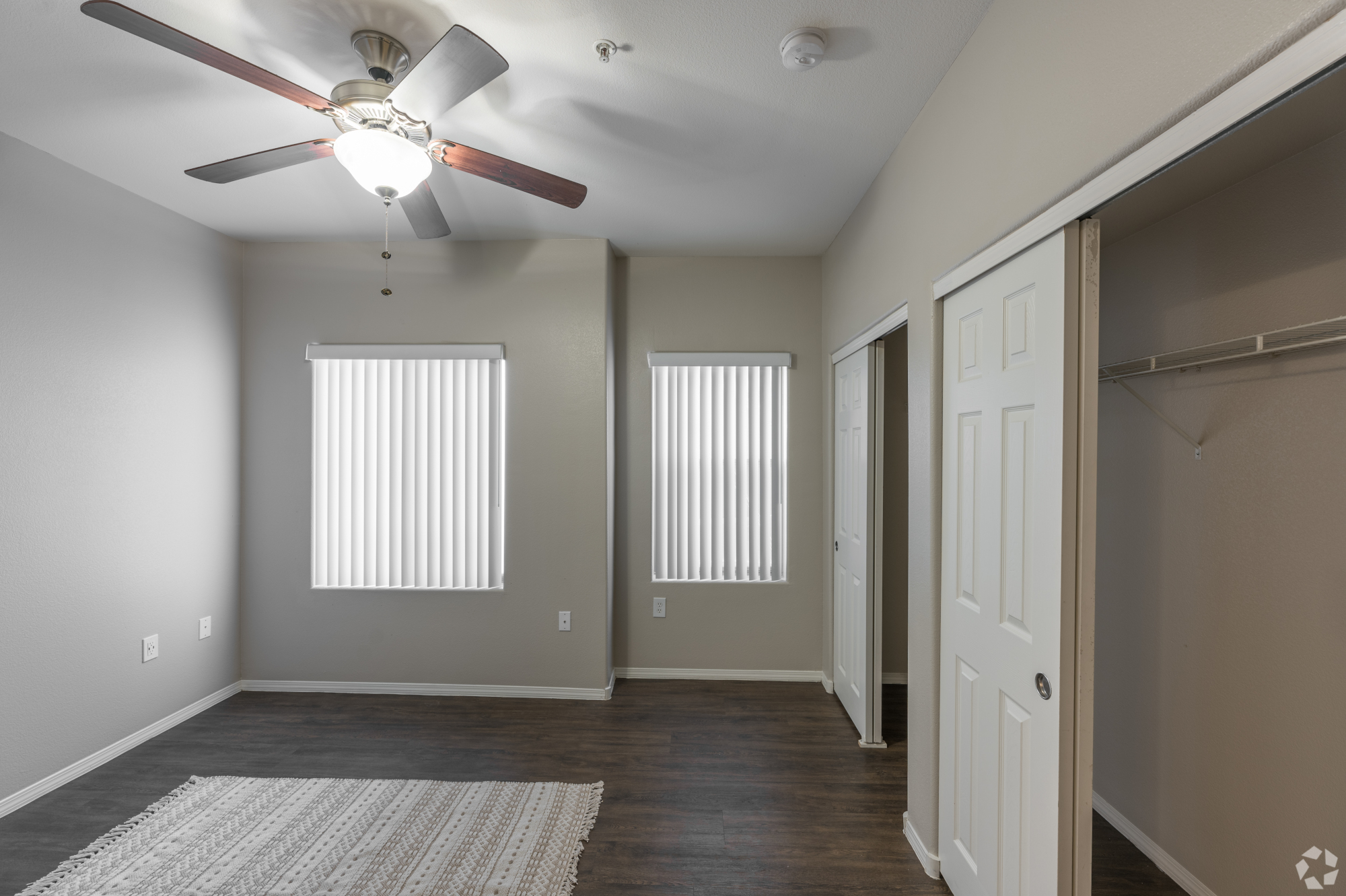 Inspirado Residences, apartment bedroom with sliding closet doors