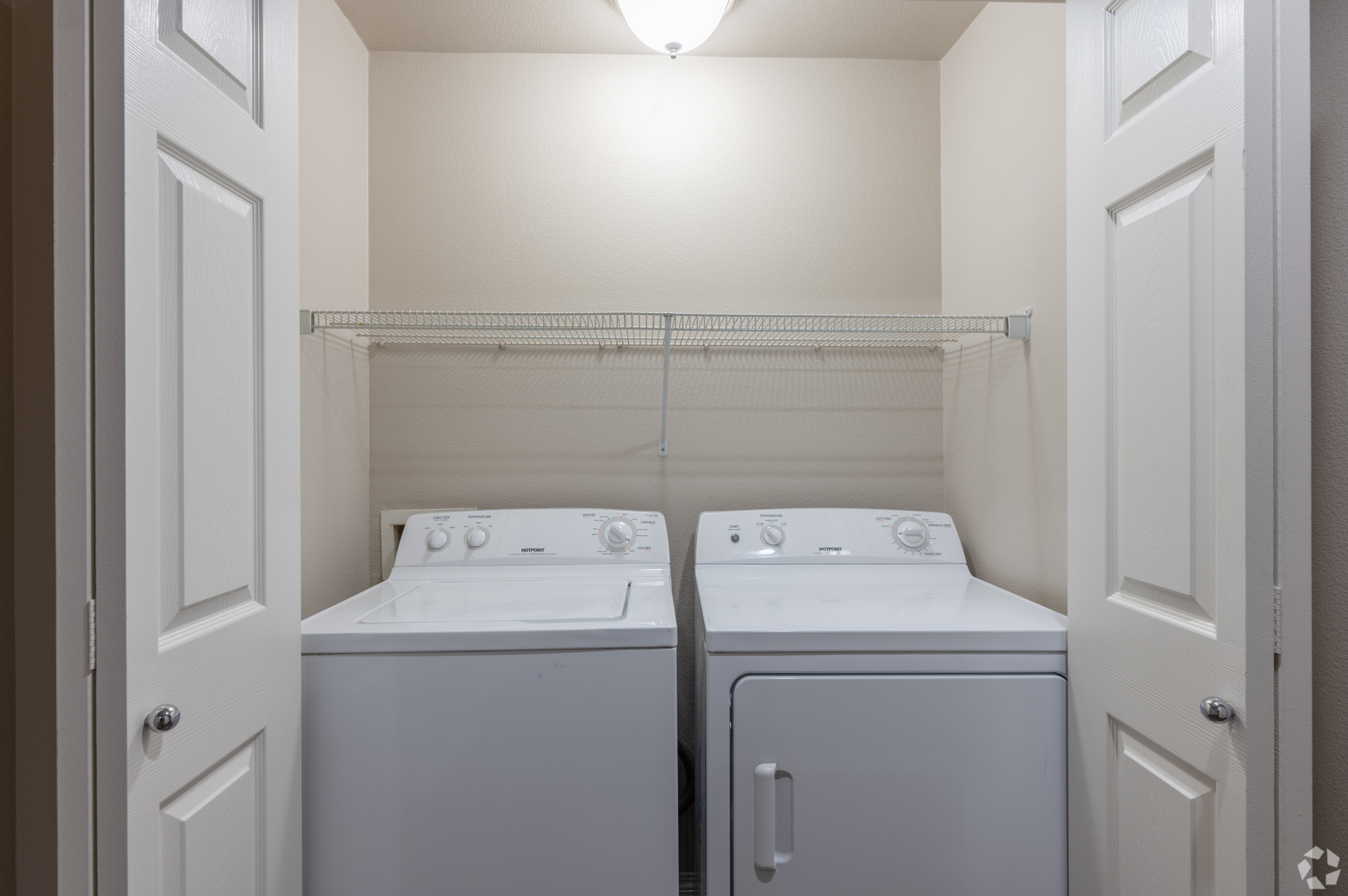 Inspirado Residences, apartment closet washer and dryer